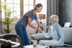 a woman is happy in her assisted living home